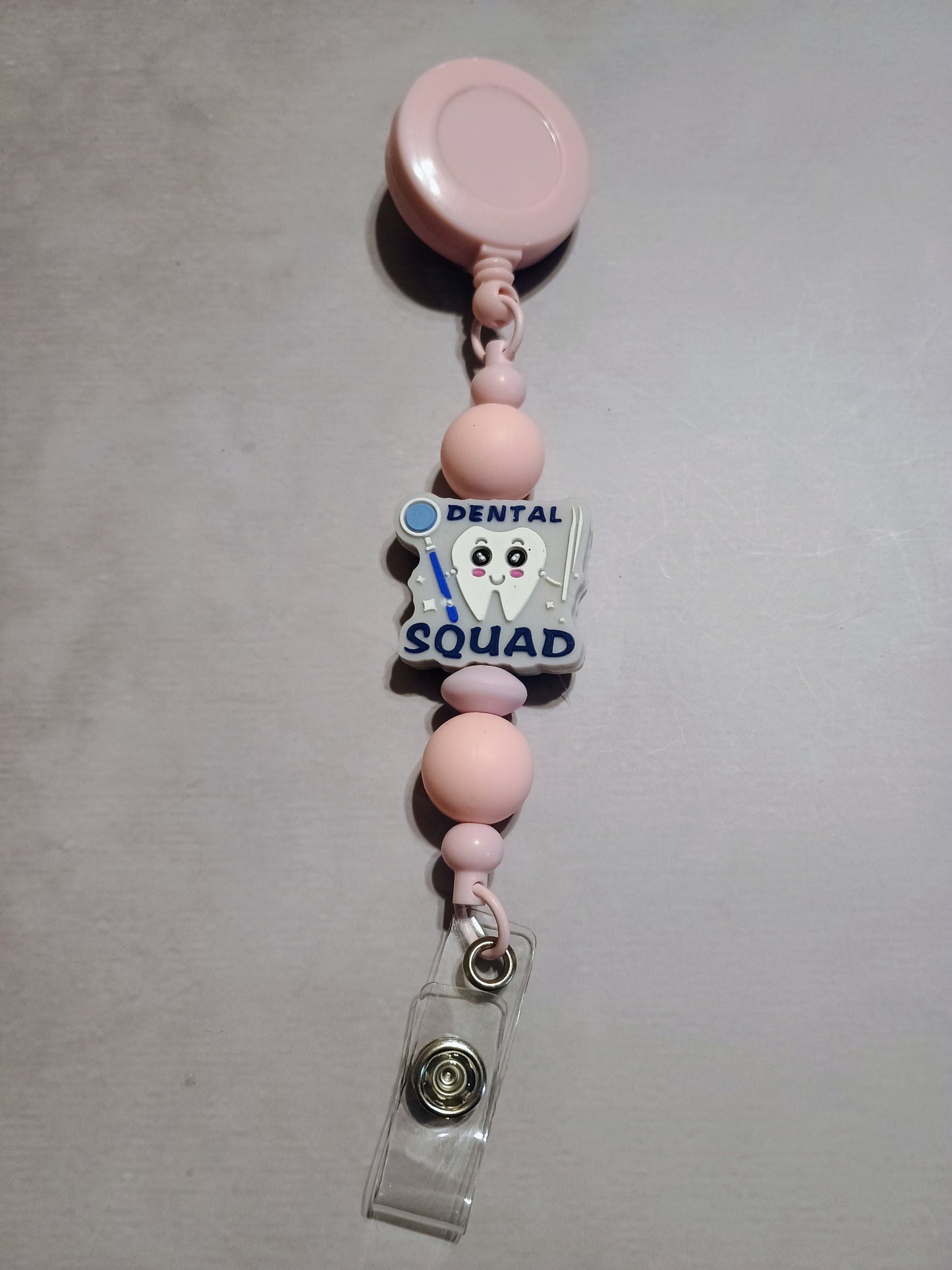 Retractable name badge clip