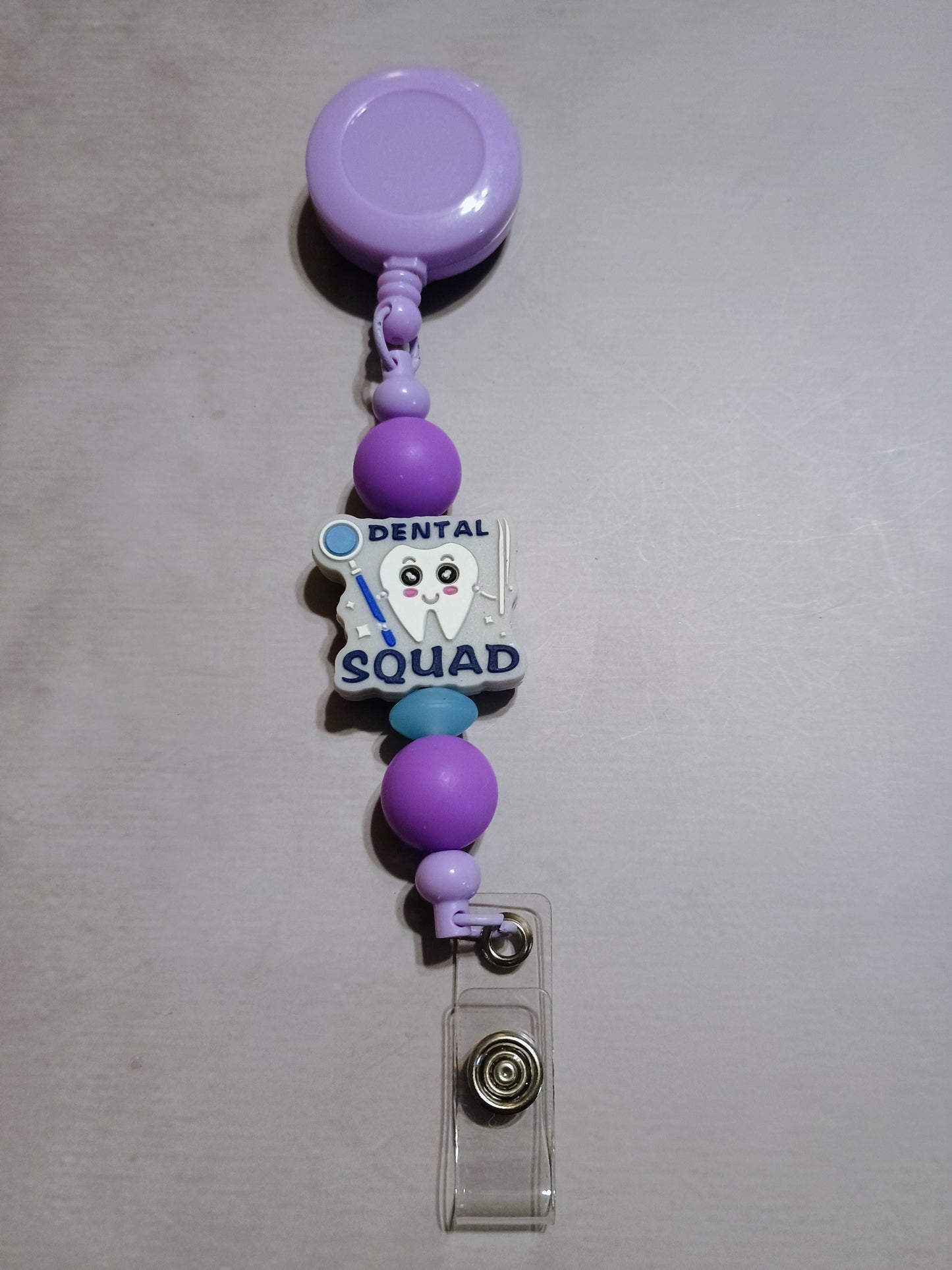 Retractable name badge clip