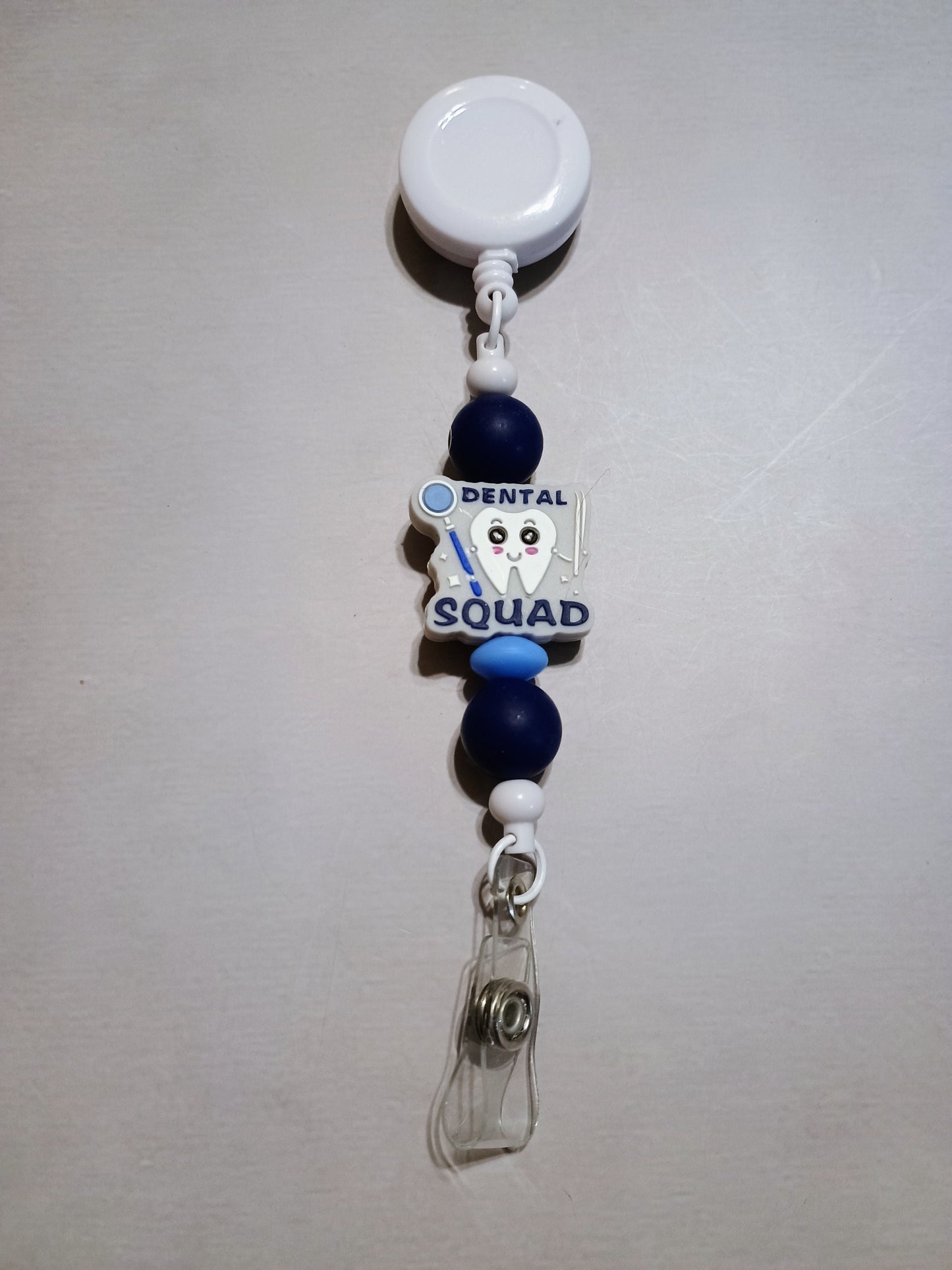 Retractable name badge clip