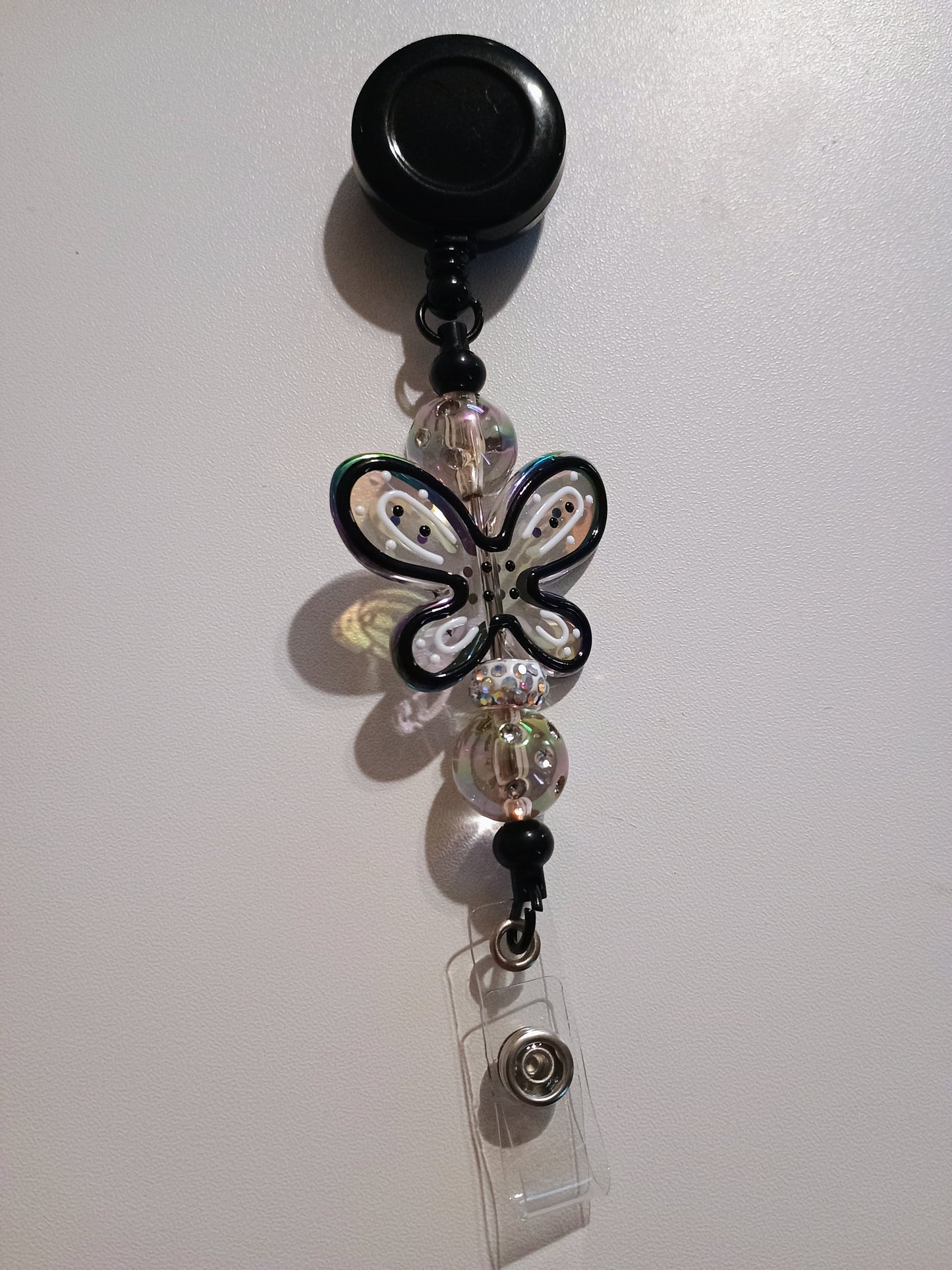 Retractable name badge clip